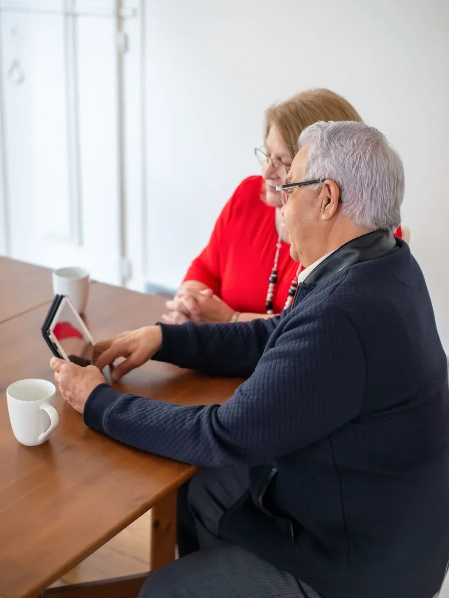 Older couple sitting together at home